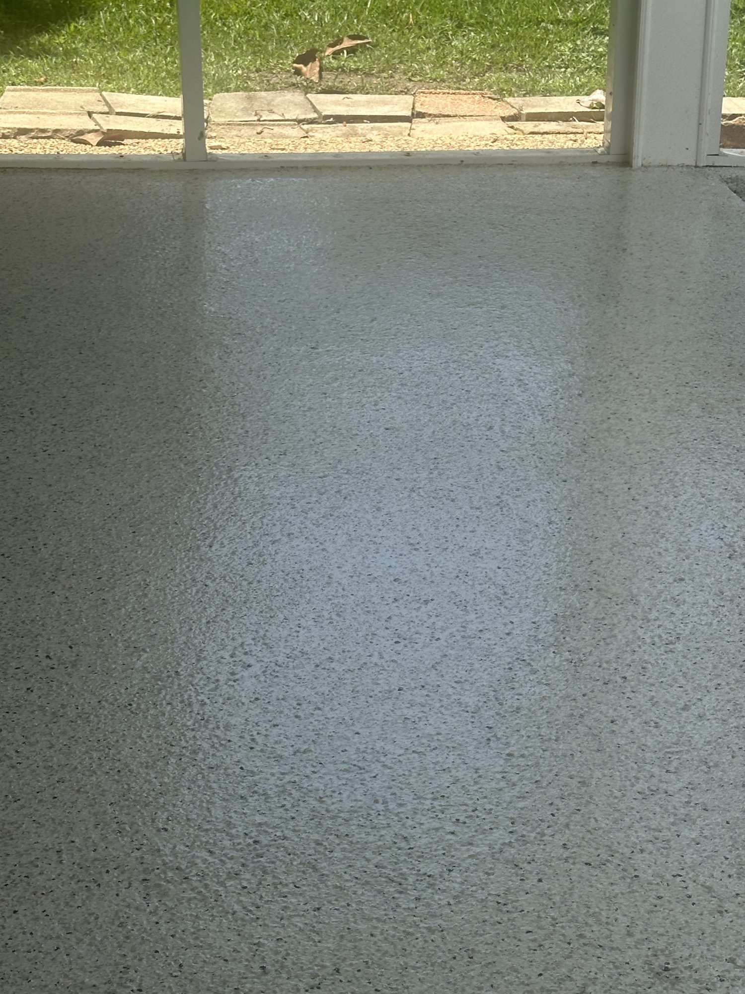 Pale flake epoxy porch floor beside a screened opening looking onto grass, Huntsville, AL
